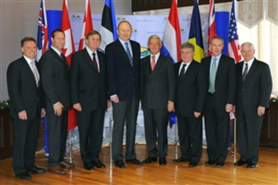 U.S. Defense Secretary Robert M. Gates, far right, and other defense ministers of Regional Command South pose for a photo and hold discussions in Cornwallis Park, Nova Scotia, Nov. 21, 2008. Gates is taking part in discussions of International Security Assistance Forces, Regional Command South, which is comprised of forces from Canada, Australia, Denmark, Estonia, Netherlands, Romania, United Kingdom, and the United States. 