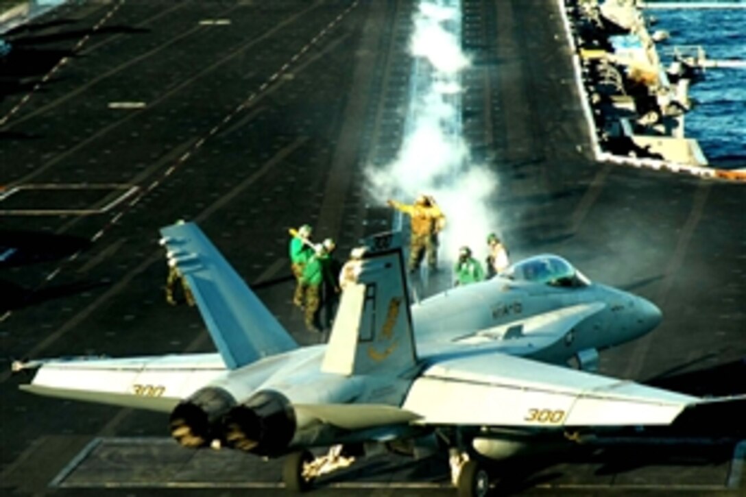 An F/A-18 Hornet aircraft assigned to the "Valions" of Strike Fighter Squadron 15  prepares to launch from the flight deck of USS Theodore Roosevelt while under way in the Gulf of Oman, Nov. 20, 2008. The Nimitz-class aircraft carrier and embarked Carrier Air Wing 8 are on deployment in the U.S. 5th Fleet area of responsibility.