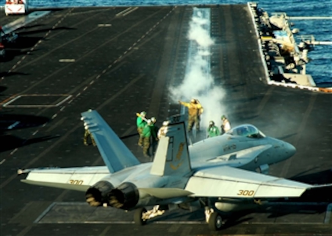 An F/A-18 Hornet aircraft assigned to Strike Fighter Squadron 15 prepares to launch from the flight deck of the aircraft carrier USS Theodore Roosevelt (CVN 71) while underway in the Gulf of Oman on Nov. 20, 2008.  The aircraft carrier and embarked Carrier Air Wing 8 are on deployment in the U.S. 5th Fleet area of responsibility.  