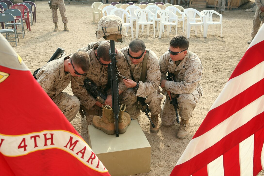 Marines with Company A, 1st Battalion, 4th Marine Regiment, Regimental Combat Team 1, gathered to remember Cpl. Aaron M. Allen, a 24-year-old team leader from Santa Barbra, Calif., with the company, who was killed while conducting combat operations in Fallujah, Iraq. A memorial service was held Nov. 22 at a combat outpost where Allen served his military duties as part of a seven-month deployment.