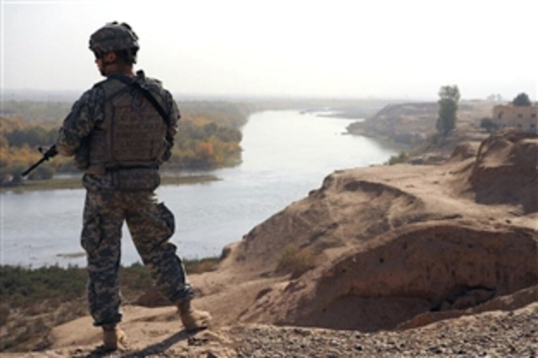 A U.S. Army soldier looks across the Tigris River while providing security during a visit to the ancient city of Ashur, the site is now known as Qalat Shergat, Iraq, Nov. 21, 2008. The soldiers are assigned to 1st Squadron, 3rd Armored Cavalry Regiment. Ashur is one of three World Heritage sites in Iraq.