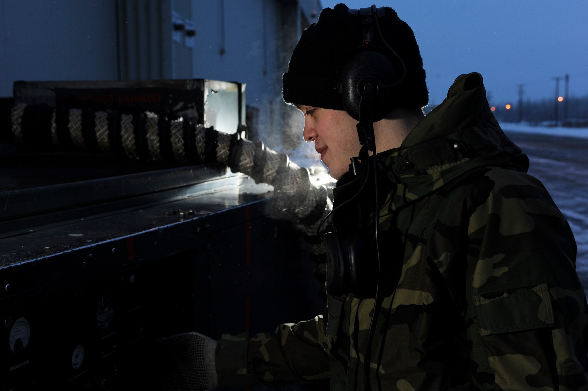 Airman Joseph Cardoza starts up aerospace ground equipment to help cool the electronics on a F-16 Fighting Falcon while performing maintenance Nov. 21, 2008, at Eielson Air Force Base, Alaska. The 354th Maintenance Squadron avionics flight is responsible for maintaining navigation and weapons system electronics on F-16 Aggressors of the 18th Aggressor Squadron enabling them to be mission-ready. He is assigned to the 354th Maintenance Squadron avionics flight.  (U.S. Air Force photo/Senior Airman Jonathan Snyder)