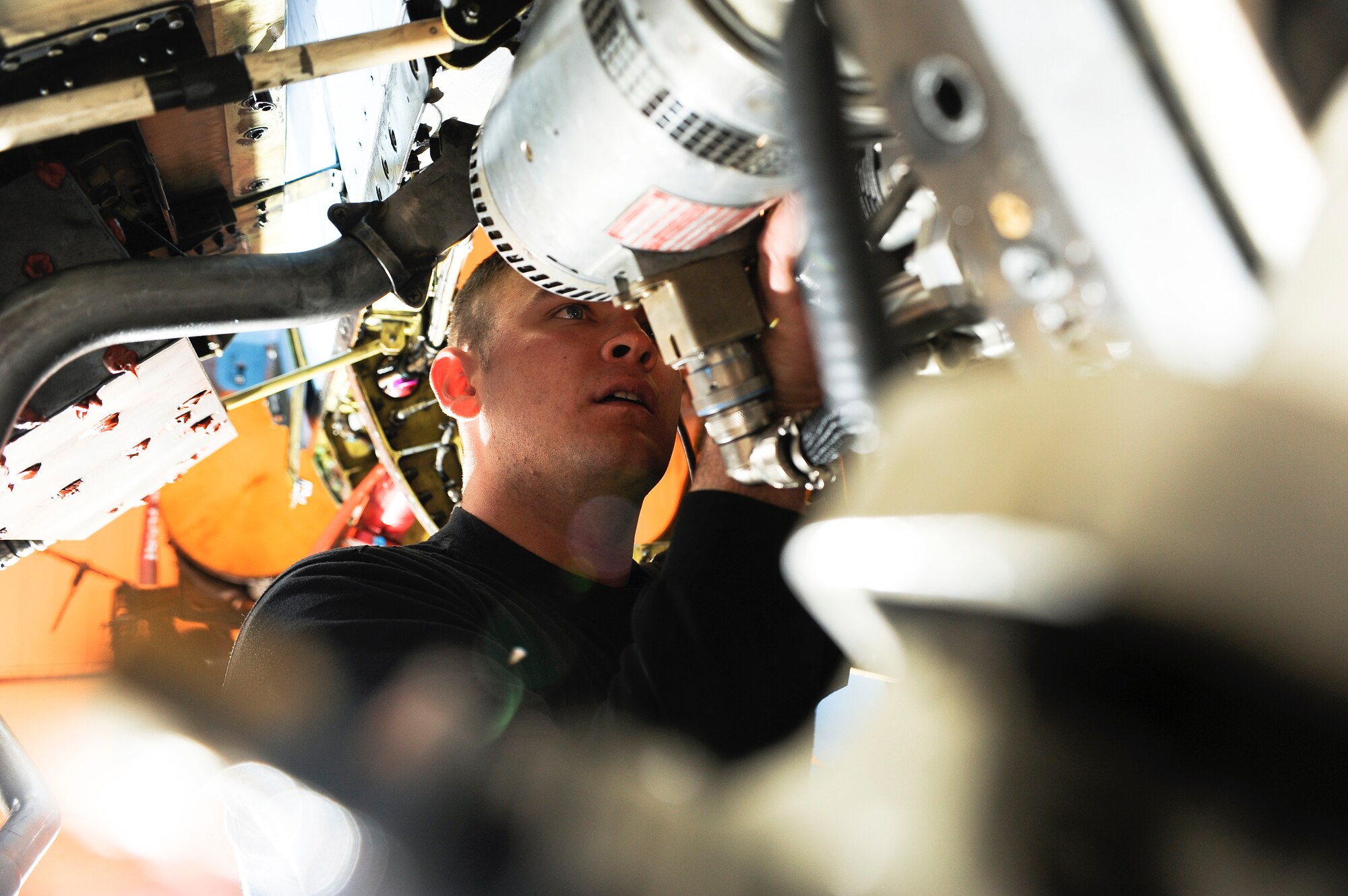 Staff Sgt. Joseph Hathaway locates and removes foreign object debris inside an F-16 Fighting Falcon Nov. 21, 2008, at Eielson Air Force Base, Alaska. The 354th Aircraft Maintenance Squadron is responsible for maintaining the F-16 Aggressors of the 18th Aggressor Squadron enabling them to be mission-ready. He is assigned to the 354th Aircraft Maintenance Squadron.  (U.S. Air Force photo/Senior Airman Jonathan Snyder)