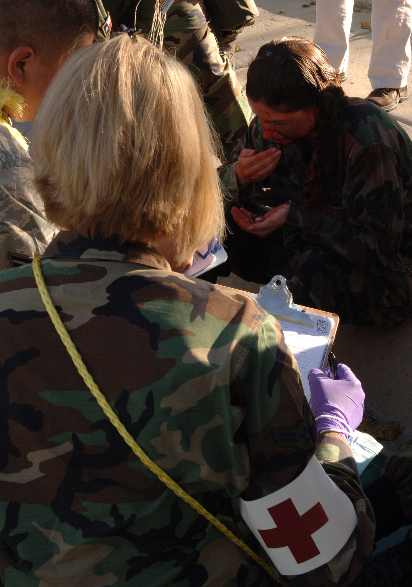 Airmen from the 49th Medical Group respond to a simulated explosion at Holloman Air Force Base, N.M., Nov. 20. The Airmen were participating in a week-long exercise, Coronet Gold Rush 08-08, to test their skills in the most realistic manner possible. (U.S. Air Force photo/Airman 1st Class Michael Means)