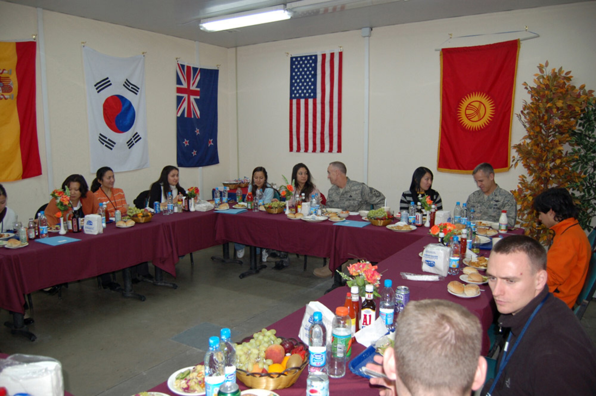 Students from the American University of Central Asia have dinner with Airmen during a Nov. 5 visit to Manas Air Base, Kyrgyzstan. Students learned about the mission and the Airmen who serve at the base. (U.S. Air Force photo/Senior Master Sgt. Patrick J. McCracken) 
