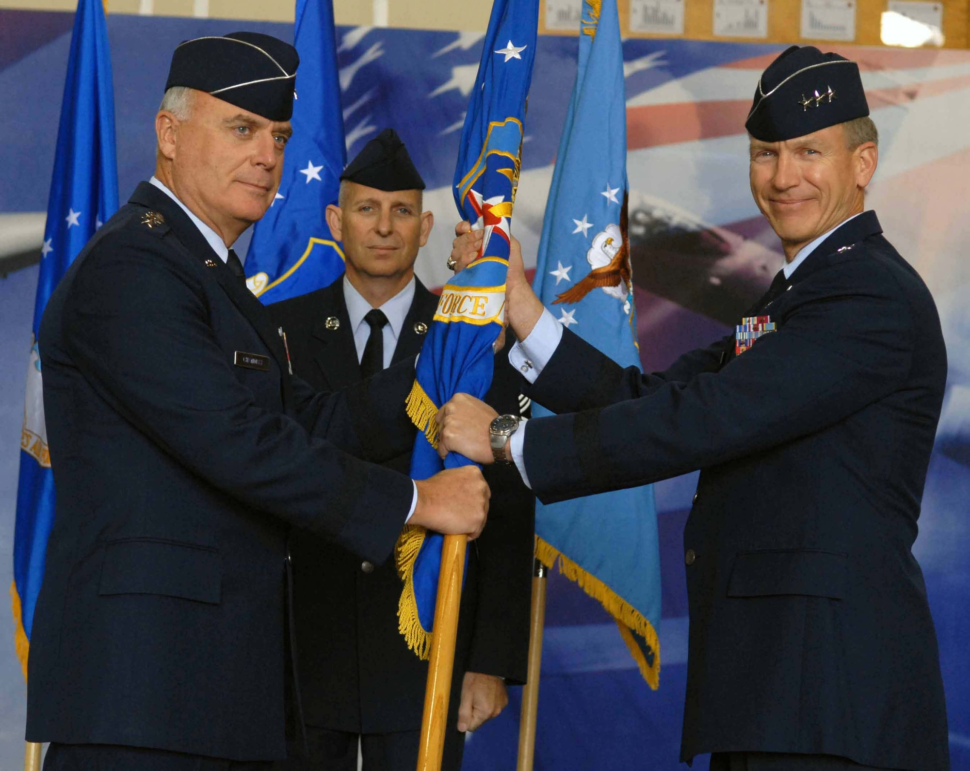 Lt. Gen. Jeffrey A. Remington (right) accepts command of the 7th Air Force from Gen. Carrol H. "Howie" Chandler during a change-of-command ceremony Nov. 24 at Osan Air Base, South Korea. General Chandler is the Pacific Air Forces commander. (U.S. Air Force photo/Senior Airman Christopher Boitz) 
