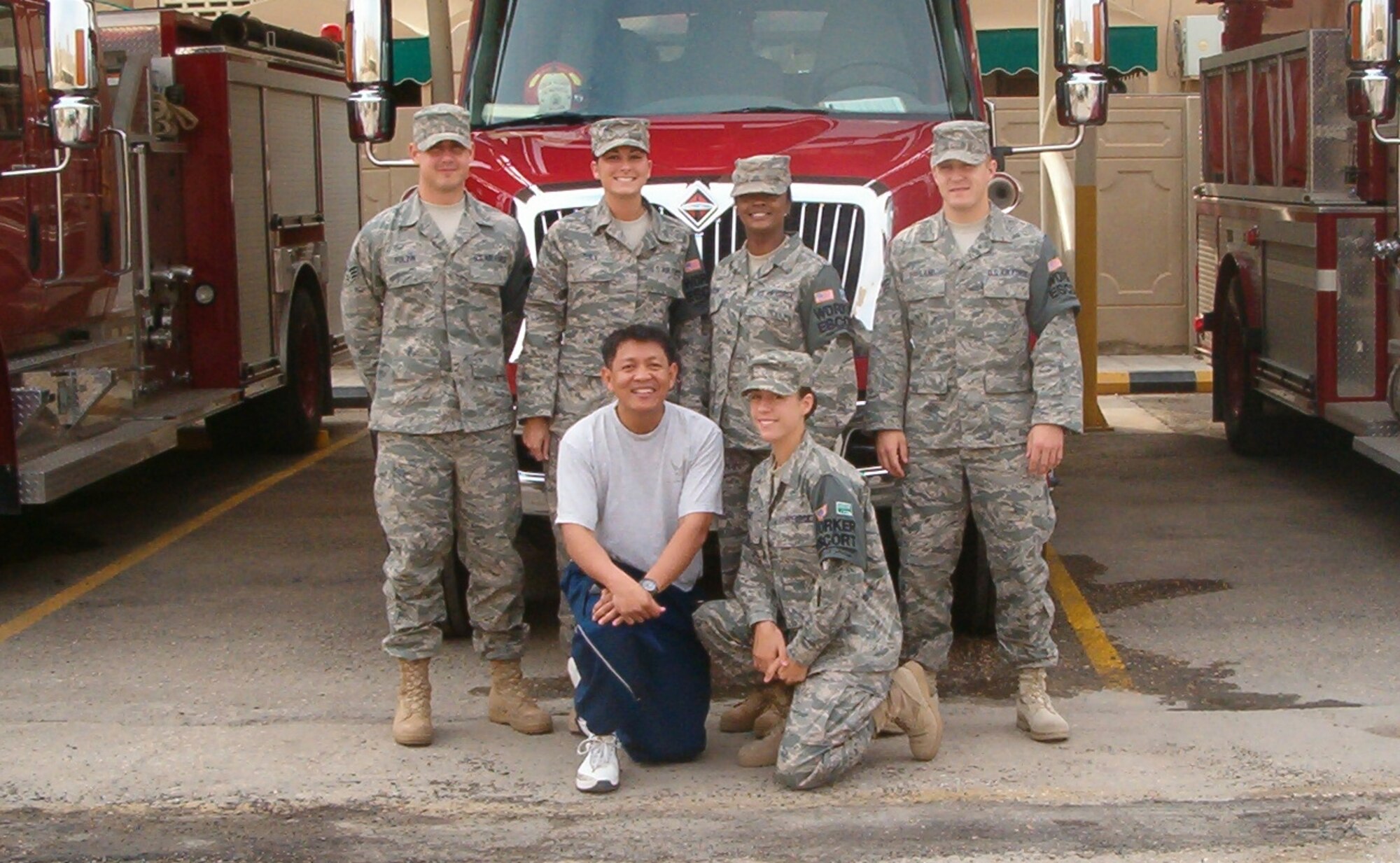 A group of Vance Airmen deployed as worker escorts at Eskan Village, Saudi Arabia, pose for a recent photo. The group thanked Team Vance for the care packages they recently received. (Standing left to right): Senior Airman Brett Polzin, Airman 1st Class Amber Tuey, Staff Sgt. Vinnice Taylor, Staff Sgt. Aaron Haviland. (Kneeling left to right): Chaplain (Capt.) Samuel Licanda and Airman 1st Class Jennifer Byrge. (Courtesy photo)