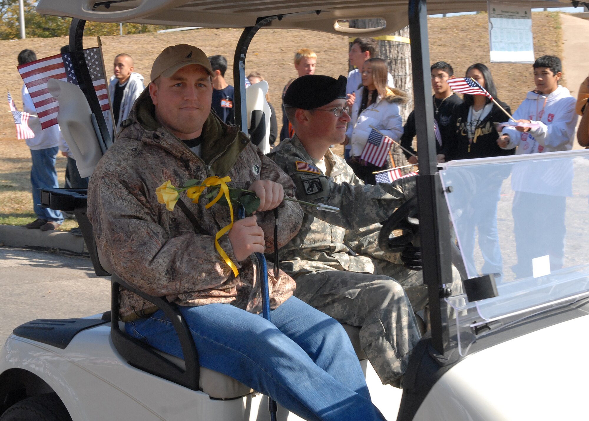 A wounded warrior rides with a military escort from Goodfellow Air Force Base in the Hunt for Heroes parade through downtown San Angelo on Nov. 21.  The parade gave members of the Goodfellow and San Angelo communities the opportunity to come out and show support for the wounded warriors who were participating in the hunt.  (U.S. Air Force photo by Senior Airman Kasabyan Musal).