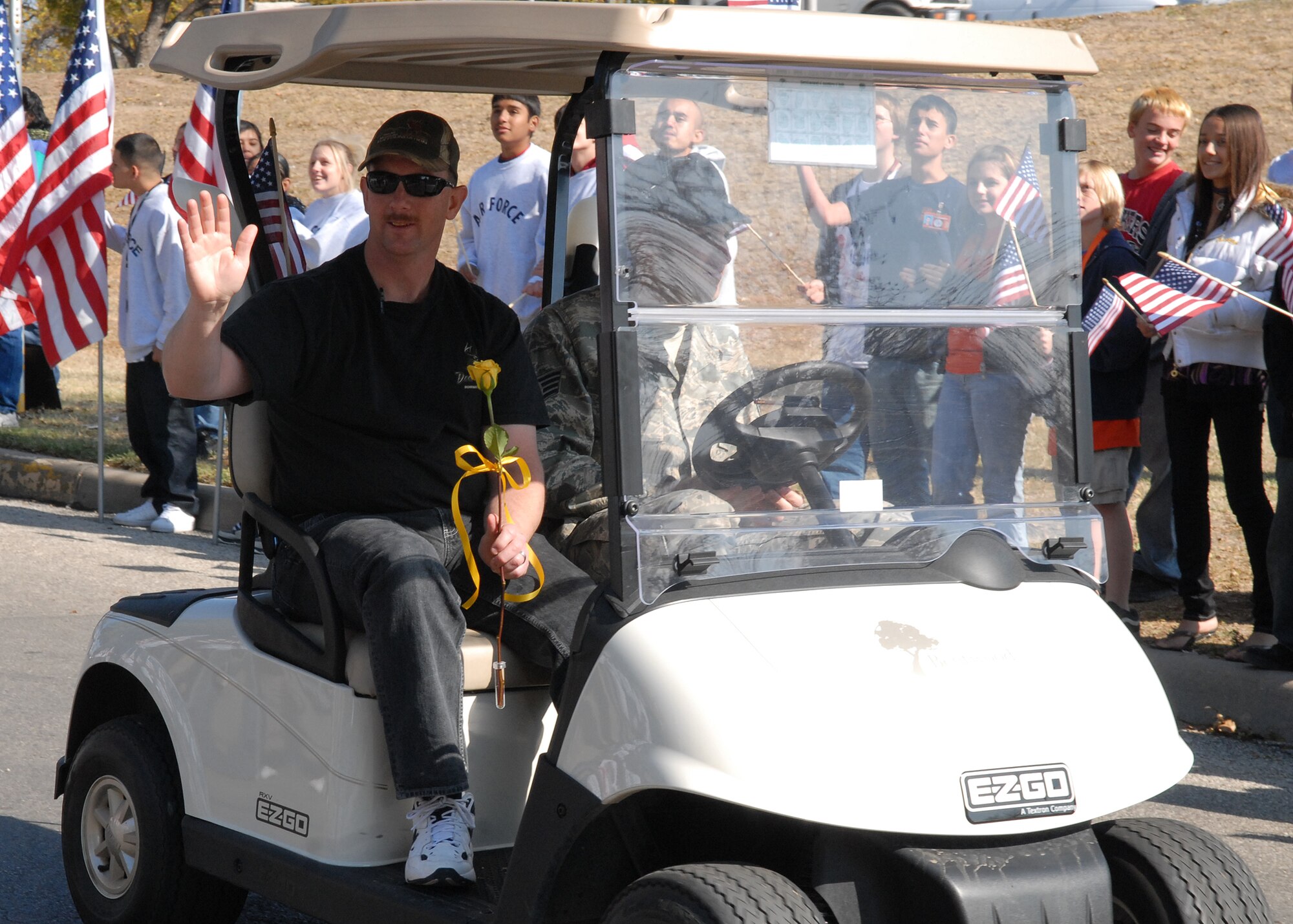A wounded warrior rides with a military escort from Goodfellow Air Force Base in the Hunt for Heroes parade through downtown San Angelo on Nov. 21.  The parade gave members of the Goodfellow and San Angelo communities the opportunity to come out and show support for the wounded warriors who were participating in the hunt.  (U.S. Air Force photo by Senior Airman Kasabyan Musal).
