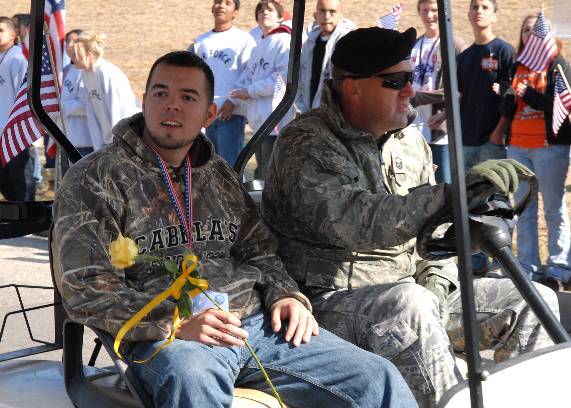 A wounded warrior rides with a military escort from Goodfellow Air Force Base in the Hunt for Heroes parade through downtown San Angelo on Nov. 21.  The parade gave members of the Goodfellow and San Angelo communities the opportunity to come out and show support for the wounded warriors who were participating in the hunt.  (U.S. Air Force photo by Senior Airman Kasabyan Musal).