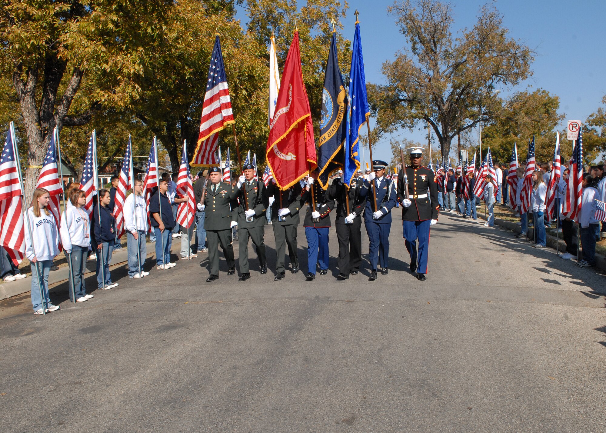 The Joint Service Color Guard from Goodfellow Air Force Base leads the Hunt for Heroes parade through downtown San Angelo on Nov. 21.  The parade gave members of the Goodfellow and San Angelo communities the opportunity to come out and show support for the wounded warriors who were participating in the hunt.  (U.S. Air Force photo by Senior Airman Kasabyan Musal).