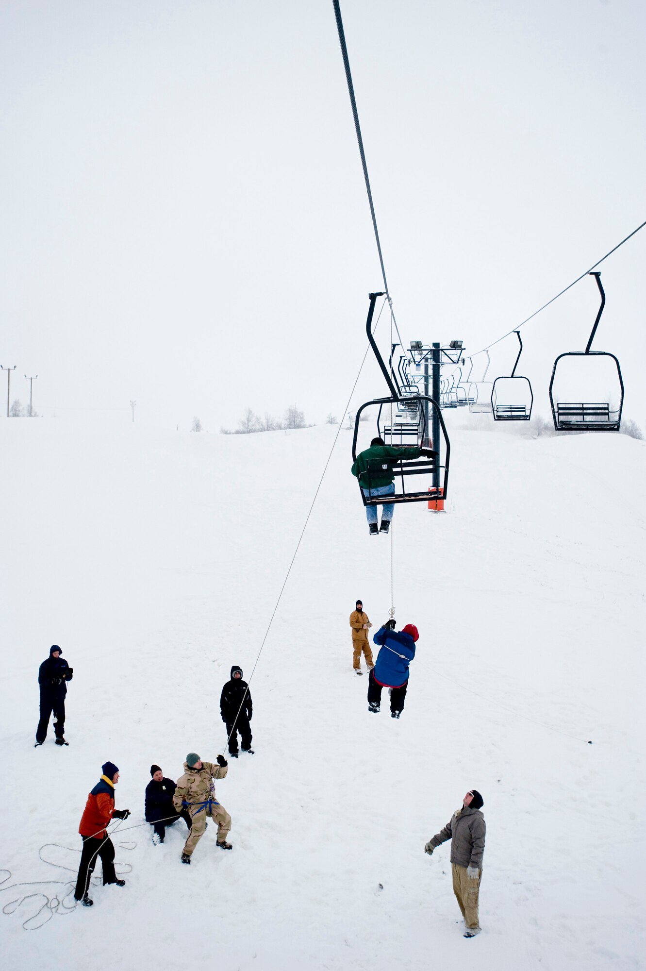 ELMENDORF AIR FORCE BASE, Alaska -- Ski patrols prepare to lower people from the ski lift at Hillberg ski hill Nov. 23. The ski patrols performed training on ski-lift evacuation prior to Hillberg’s opening this week. (U.S. Air Force photo/Senior Airman Jonathan Steffen)