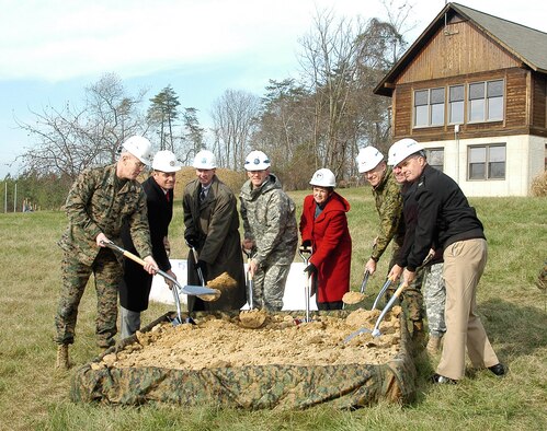 Mr. Thomas, Air Force Office of Special Investigations Executive Director (third from left) and senior agency representatives from the Army's Criminal Investigative Command, the Defense Security Service, the Naval Criminal Investigative Service, and elements of the Defense Intelligence Agency armed up with shovels and jointly turned the first soil for the new Military Department Investigative Agencies facility located at Marine Corps Base Quantico, Va.
