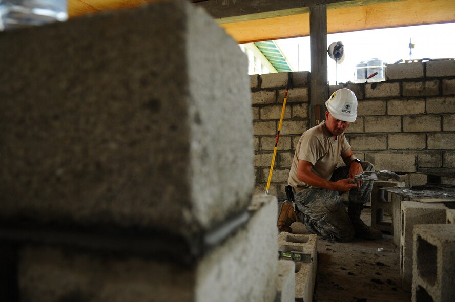 GEORGETOWN,Guyana -- Master Sgt. Roger Scott, 5th Civil Engineer Squadron operations chief currently embarked aboard the amphibious assault ship USS Kearsarge (LHD 3), builds a block wall at the West Demarara Regional Hospital here during the humanitarian and civic assistance mission Continuing Promise 2008. Approximately 40 Airmen from 5th CES are supporting CP 2008, a four-month mission in the U.S. Southern Command area of responsibility. (U.S. Navy photo by Mass Communication Specialist Seaman Apprentice Joshua Adam Nuzzo)