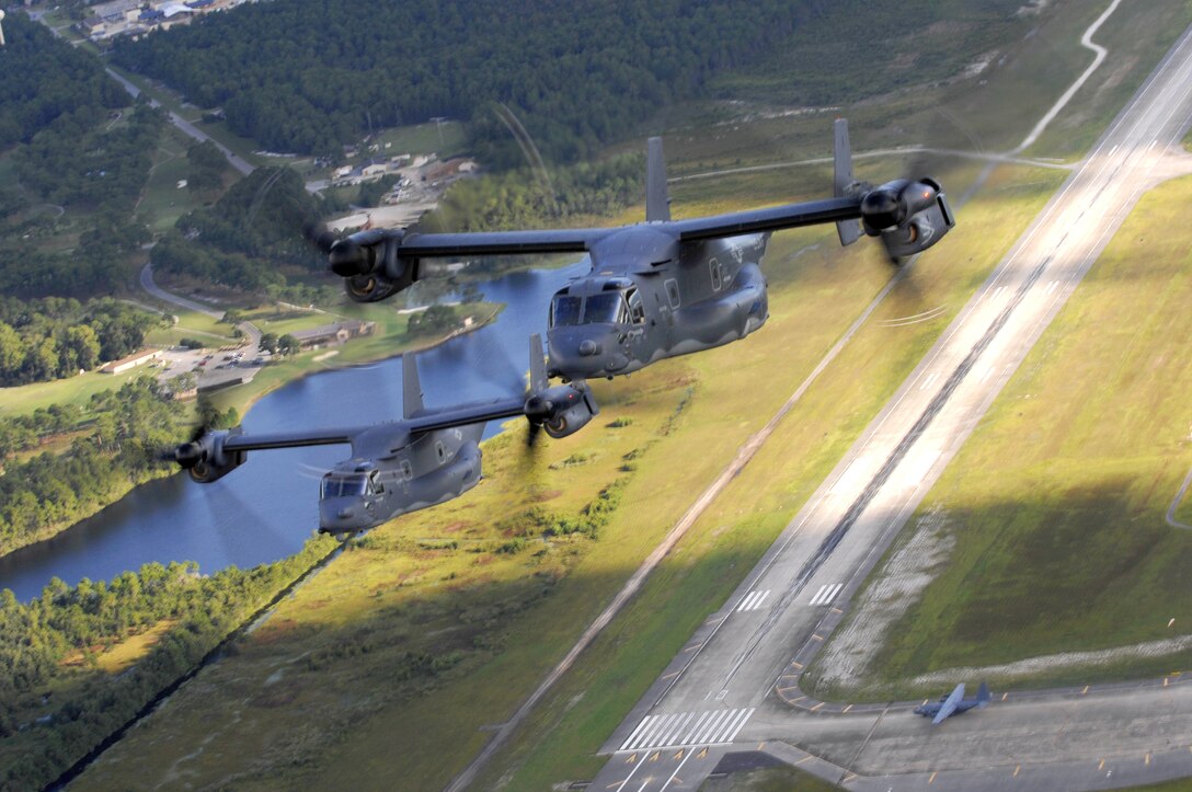 Two CV-22 Osprey from the 8th Special Operation Squadron, fly over the coast here, on Aug. 20. The CV-22 Osprey is a tilt rotor aircraft that combines the vertical takeoff, hover, and vertical landing qualities of a helicopter with the long-range, fuel efficiency, and speed characteristics of a turboprop aircraft. Its mission is to conduct long-range inflitration, exfiltartions and resupply missions for special operations forces.