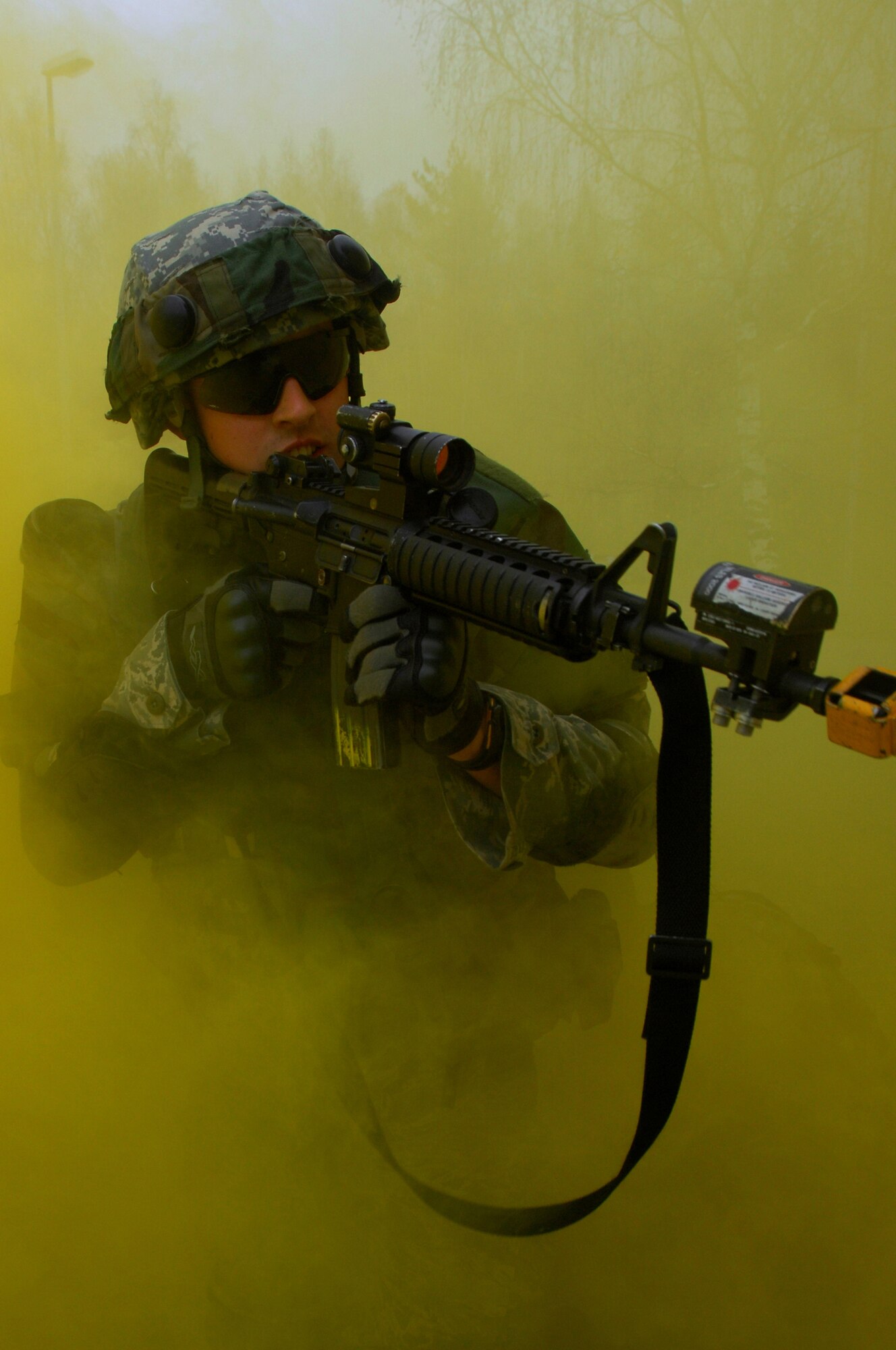 Airman 1st Class Tyler McEuin, 423rd Security Forces Squadron, Royal Air Force Alconbury, England, moves through smoke in pursuit of the enemy during urban operations training as a part of a two-week long Creek Defender course, Nov. 18, 2008, Baumholder, Germany. (U.S. Air Force photo by Airman 1st Class Kenny Holston)