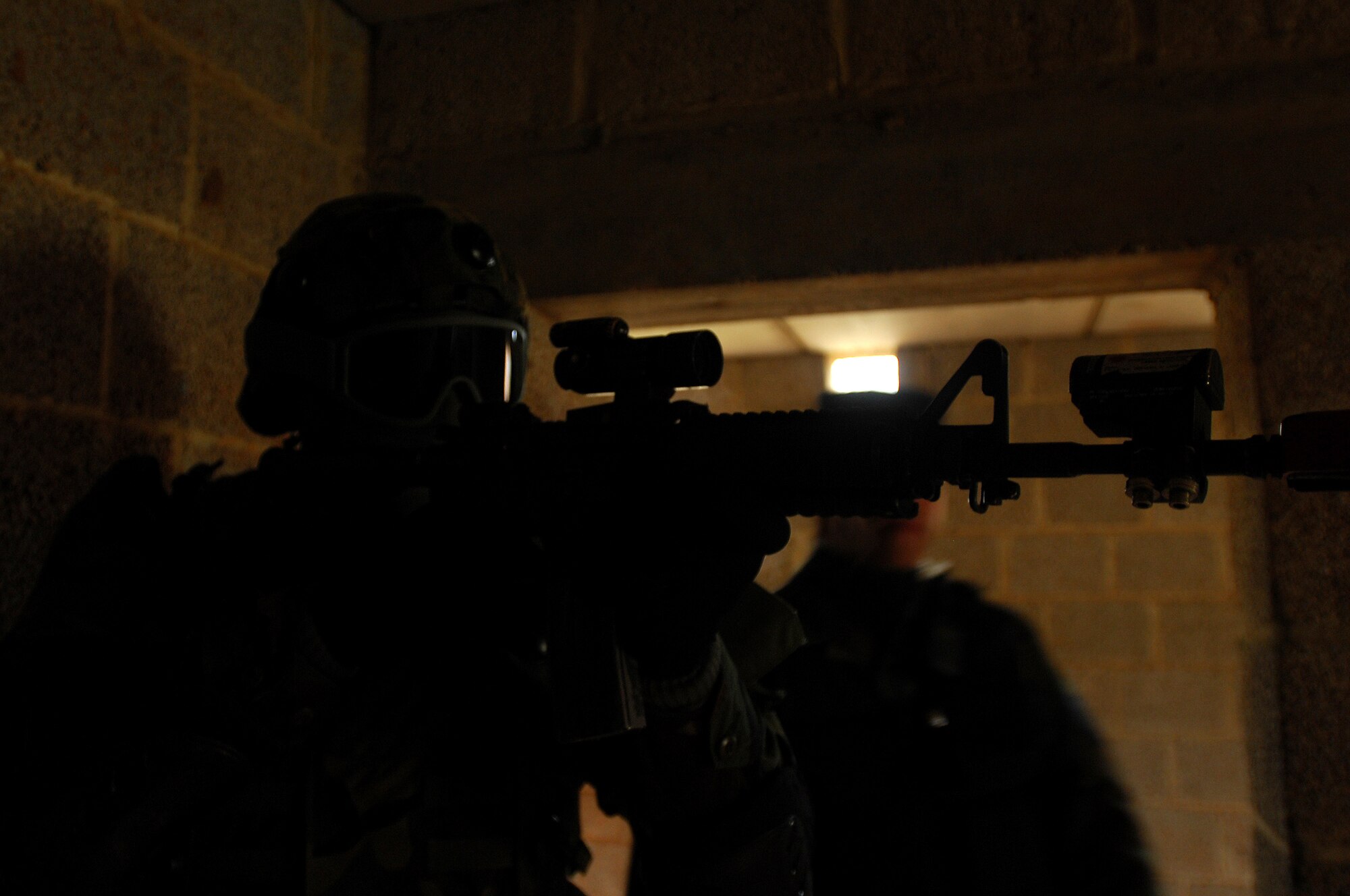 Airman 1st Class Robert Meza, 422nd Security Forces Squadron, Royal Air Force, Croughton, England, keeps his eyes on target during urban operations training as a part of a two-week long Creek Defender course, Nov. 18, 2008, Baumholder, Germany. (U.S. Air Force photo by Airman 1st Class Kenny Holston)   