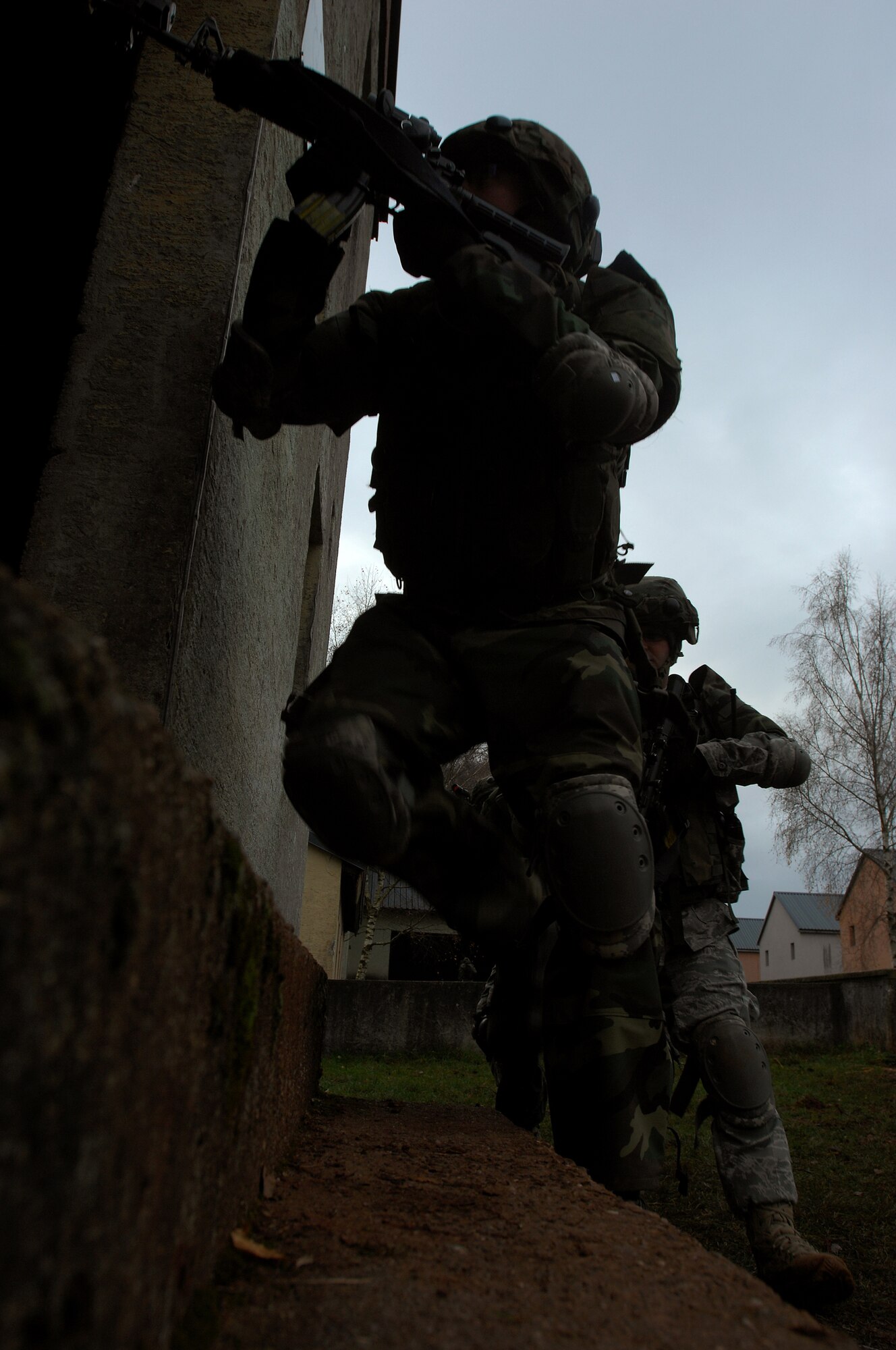 Airman 1st Class Michael Adams, 423rd Security Forces Squadron, Royal Air Force Alconbury, England, leads his fire team into a building during urban operations training as a part of a two-week long Creek Defender course, Nov. 18, 2008, Baumholder, Germany. (U.S. Air Force photo by Airman 1st Class Kenny Holston)