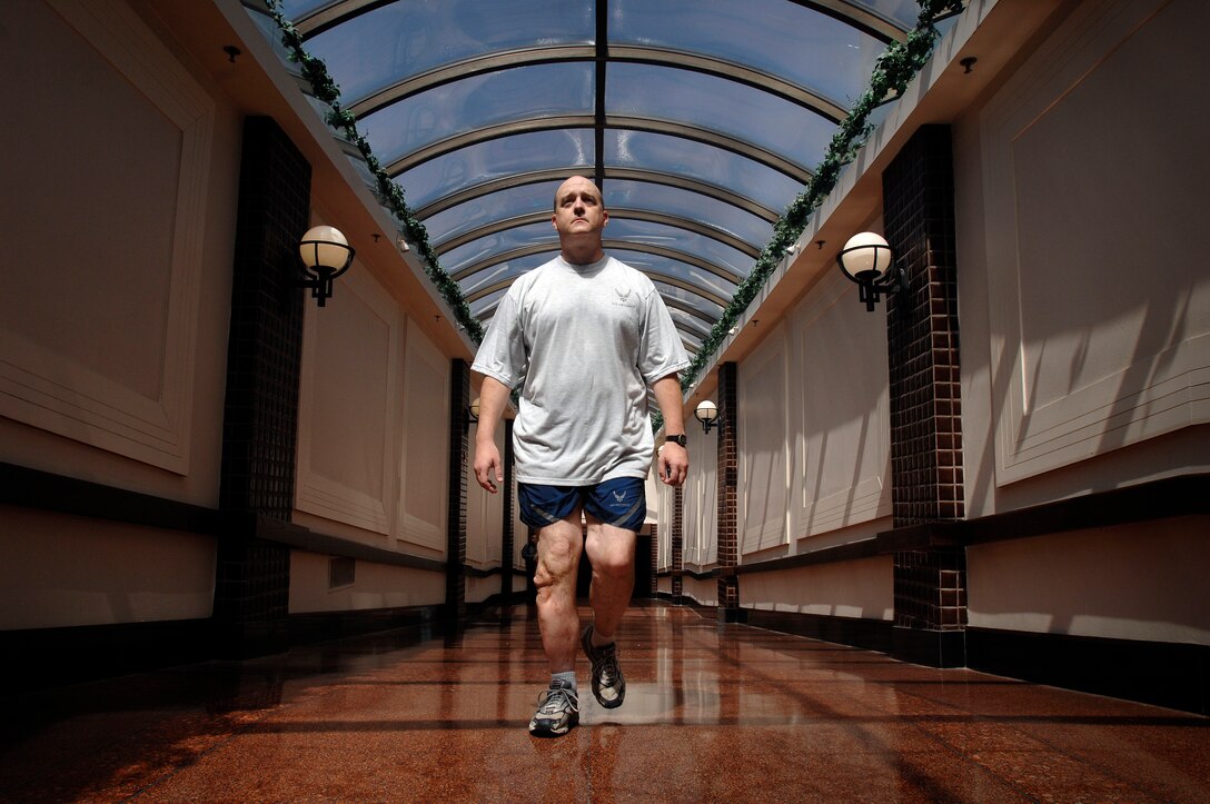 Air Force Maj. Matthew Conlan walks through the cavernous tunnel system below his office in the Crystal City area of Arlington, Va. Conlan was injured in Afghanistan in 2005 and returned to active duty to work at the Air Force's counter-improvised explosive device office. DoD photo by Fred W. Baker III  