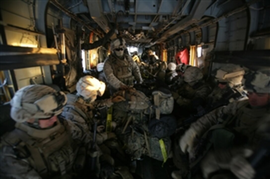 U.S. Marines of Lima Company, 3rd Battalion, 8th Marine Regiment ride a CH-53E Super Stallion helicopter from Camp Bastion, Afghanistan, to Now Zad, Afghanistan, on Nov. 17, 2008.  The Marines, based out of Marine Corps Base Camp Lejeune, N.C., are deployed to Afghanistan in support of the NATO mission.  