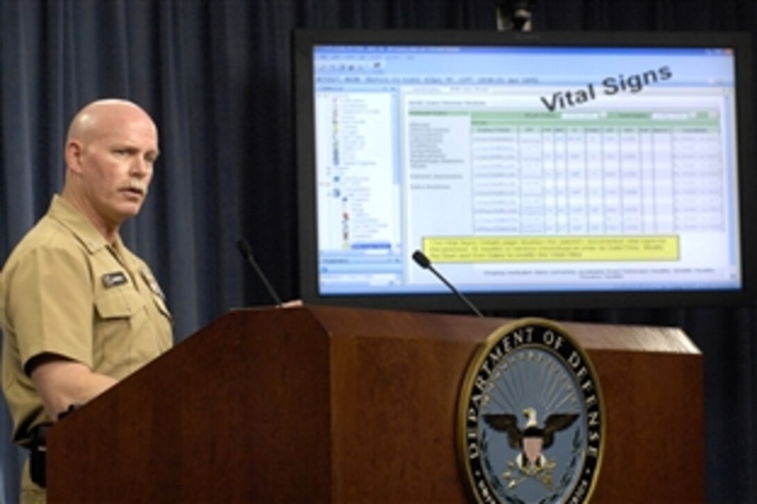 U.S. Navy Capt. Bob Marshall, a medical doctor at the Navy Bureau of Medicine, gives an interactive demonstration of the technology involved in sharing electronic health information between the departments of Defense and Veterans Affairs. Marshall was one of six officials to highlight the new system at a press briefing at the Pentagon, Nov. 24, 2008.