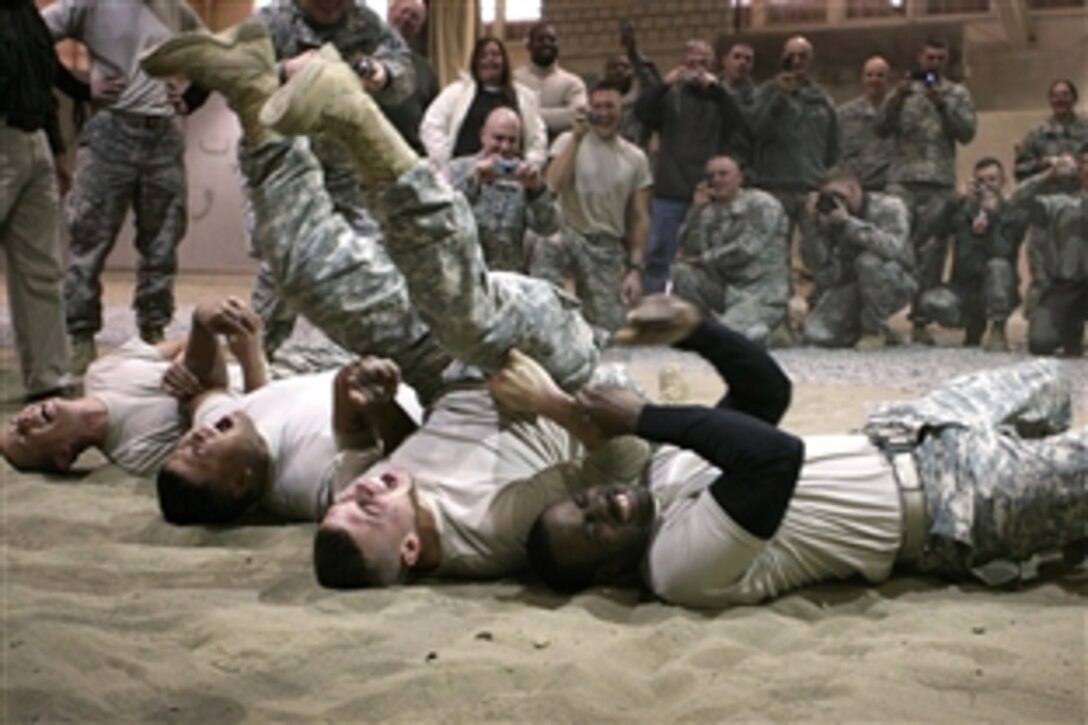 U.S. Army soldiers, assigned to the 10th Mountain Division, feel the effects of a Taser during non-lethal weapons training on Fort Drum, N.Y., Nov. 19, 2008.