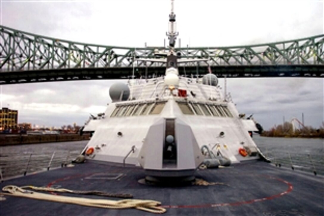 The littoral combat ship USS Freedom sails under the Jacques Cartier Bridge as the ship heads to the Old Port of Montreal, Nov. 20, 2008. The USS Freedom is the first of two littoral combat ships designed to operate in shallow water environments to counter threats in coastal regions and is en route to Norfolk, Va.