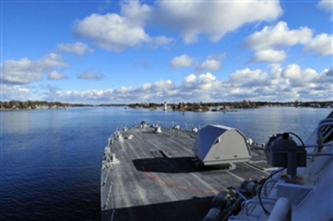 The littoral combat ship USS Freedom sails upstream in the Saint Lawrence River, Nov, 19, 2008. Freedom is the first of two littoral combat ships designed to operate in shallow water environments to counter threats in coastal regions. It is en route to Norfolk, Va.