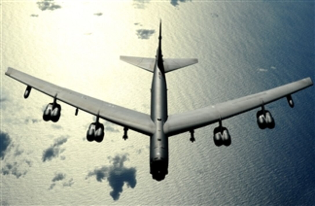 A B-52 Stratofortress aircraft out of Minot Air Force Base, N.D., flies over the Pacific Ocean on Nov. 13, 2008.  The aircraft is deployed to the 23rd Expeditionary Bomb Squadron at Andersen Air Force Base, Guam, and is part of a continuing operation to maintain a bomber presence in the region.  