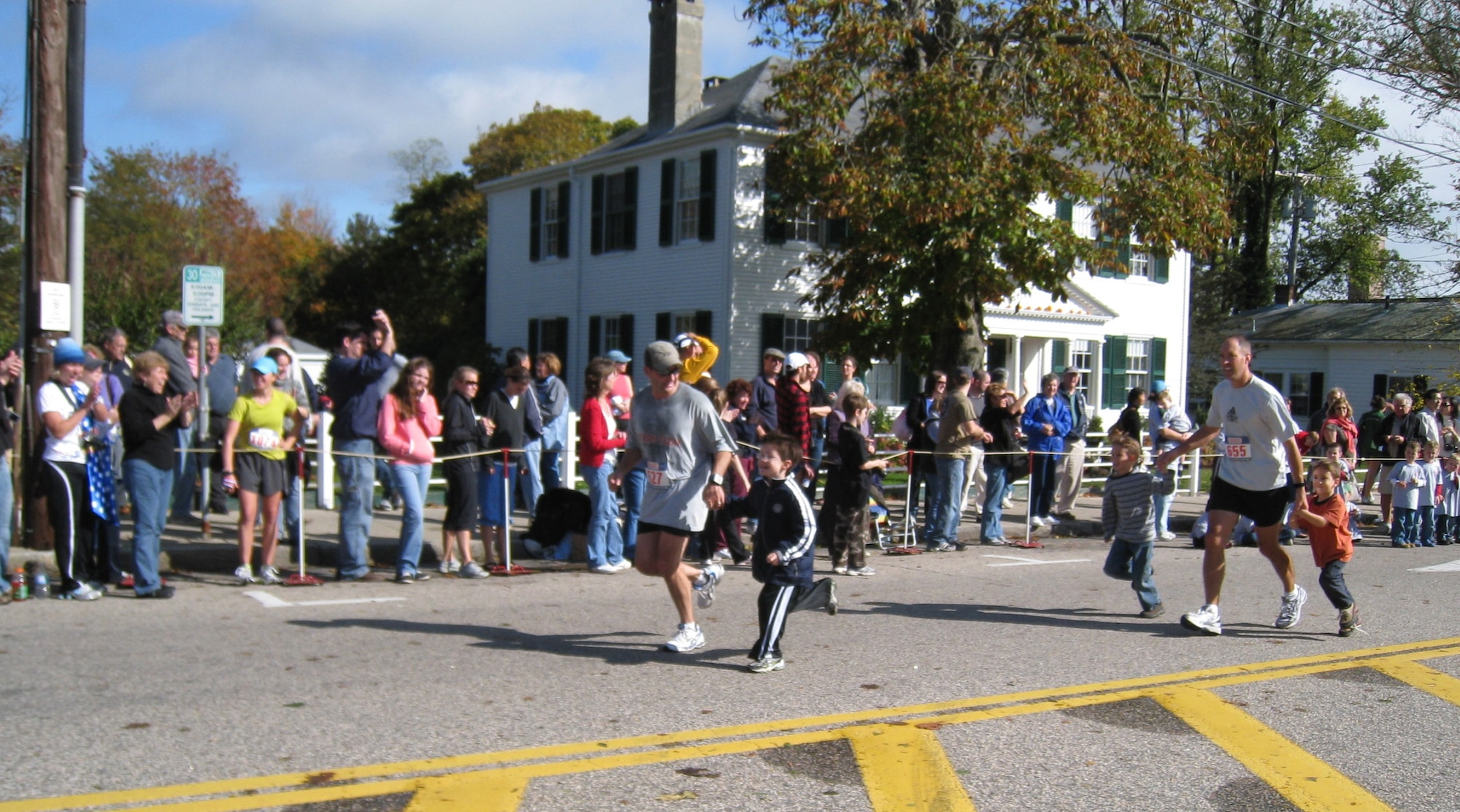 Cape Cod Air Force Station’s 6th Space Warning Squadron Commander, Lt. Col. Max Lantz, and Director of Operations, Lt. Col. Scott Schroff, conquered the Cape Cod Marathon Oct. 26 in Falmouth, Mass., bolstered here by their sons.  “I couldn’t be more impressed with Colonel Schroff on completing his first marathon,” said the 6th SWS commander.  “He ran a very good race, staying mentally strong for the entire 26.2 miles.” (Courtesy photo/Leslie Lantz)