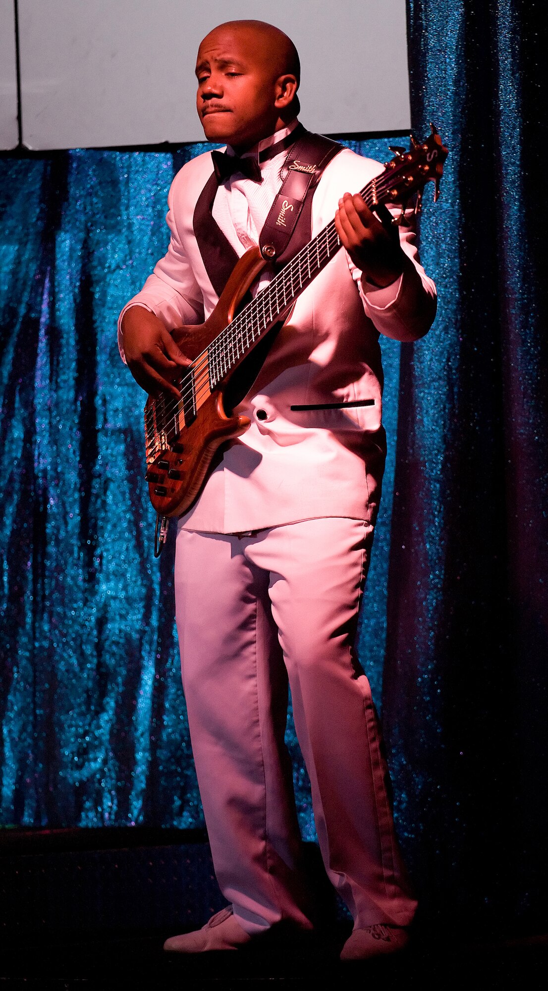 Airman 1st Class Henry Roberson, III, Tops In Blue musician, jams out his bass guitar during the Tops In Blue show Nov. 19. (U.S. Air Force photo/Jason Minto)