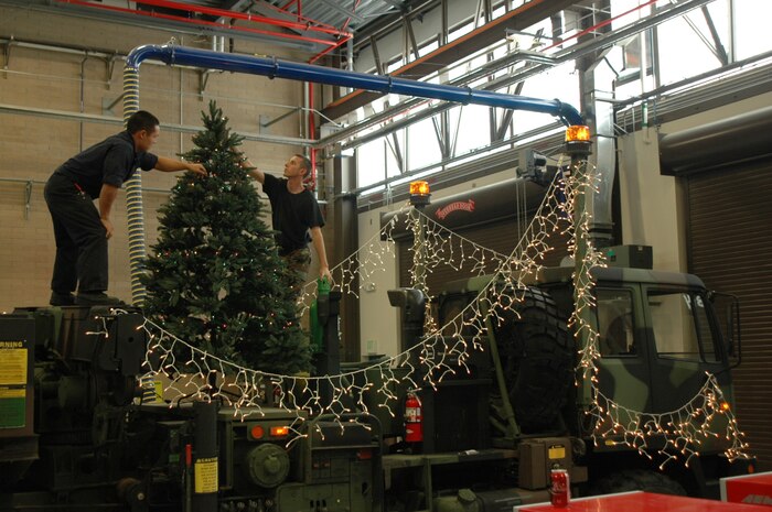 Airman Henry Chung and Senior Airman Josh Boney, 729th Air Control Squadron, prepare a M-1089A-1 FMTV Wrecker for Ogden's 2008 Holiday Electric Light Parade, Nov. 29.