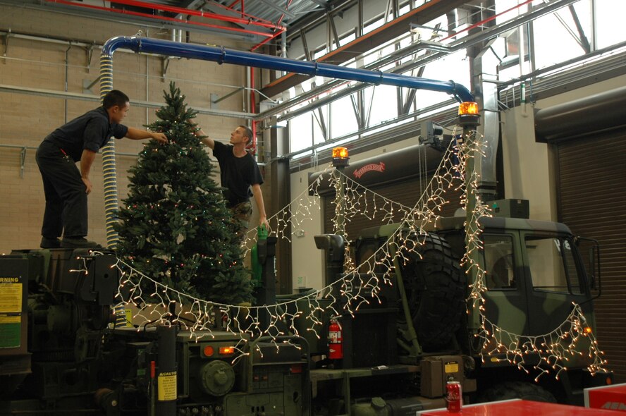 Airman Henry Chung and Senior Airman Josh Boney, 729th Air Control Squadron, prepare a M-1089A-1 FMTV Wrecker for Ogden's 2008 Holiday Electric Light Parade, Nov. 29.