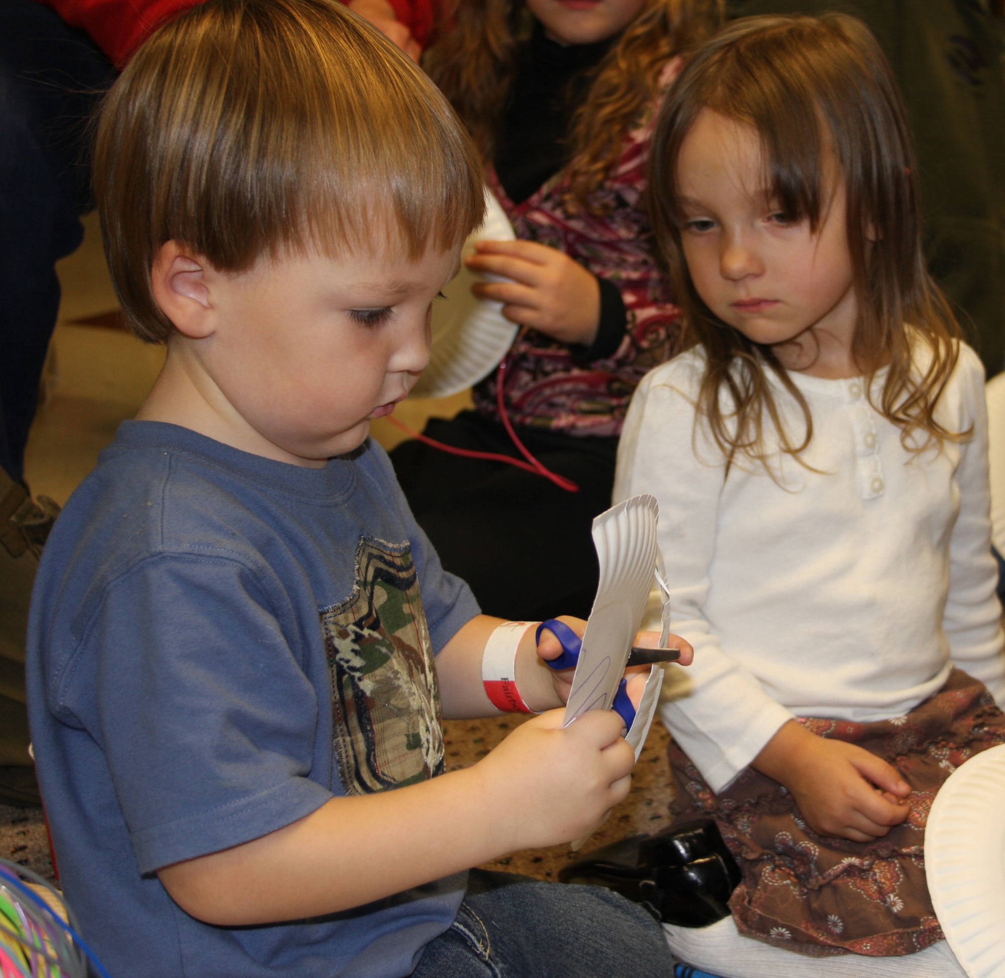 WRIGHT-PATTERSON AFB, Ohio - Jack Stout and Teagan Lowman, children of deploying reservists from the 445th Airlift Wing, work on a craft project during the Yellow Ribbon Pre-deployment Town Hall meeting.  Jack is the son of Staff Sgt. Timothy Stout, 445th Security Forces Squadron, and Teagan is the daughter of Tech. Sgt. Nathan Lowman, 445th Maintenance Operations Flight. More than 90 445th Airlift Wing reservists and family members attended the Yellow Ribbon Pre-Deployment Town Hall meeting Nov. 18 and 19, 2008. The town hall marked the first pre-deployment Yellow Ribbon Town Hall hosted by an Air Force Reserve Command unit. (Air Force photo/Laura Darden)(Air Force photo/Laura Darden)