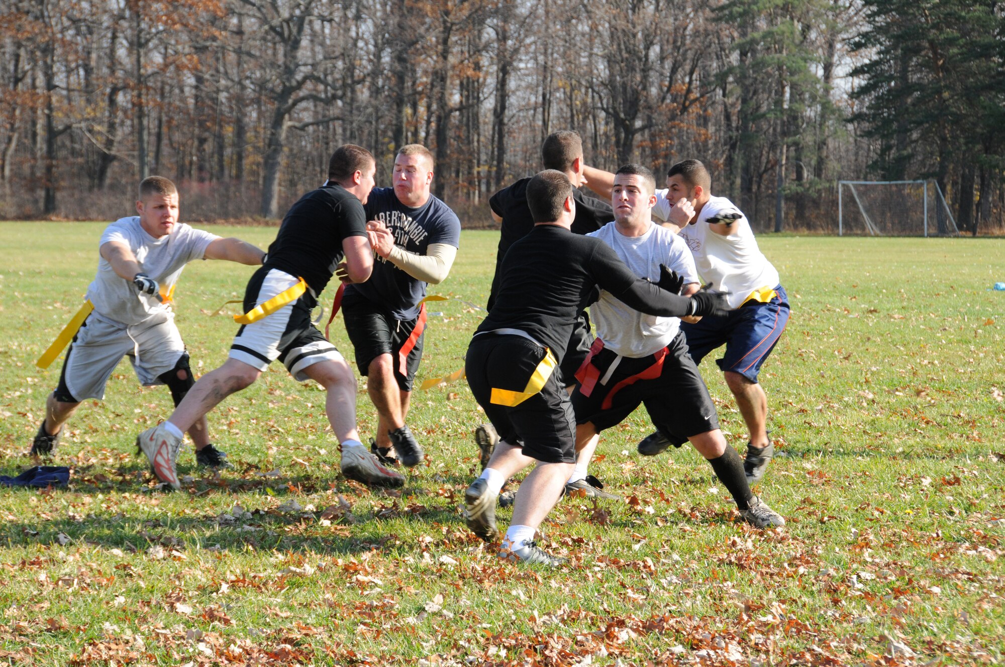 107th Airlift Wing, Security Force members hold their own against the U.S. Coast Guard, Cleveland Station, Ohio. Both teams came ready to play for a worthy cause. The first Toys for Tots Flag Football tournament was recently held at Fort Niagara State Park. U.S. Air Force photo/Senior Airman Peter Dean