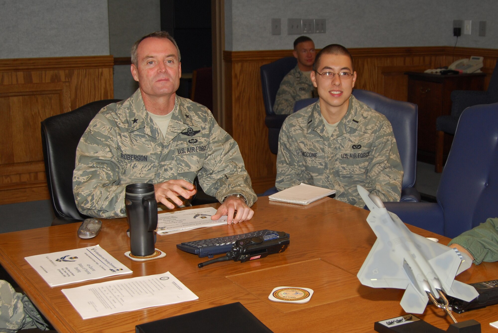 1st Lt. Nick Saccone, 325th Mission Support Group executive officer, shadows Brig. Gen. Darryl Roberson, 325th Fighter Wing commander, during the commander’s staff meeting here today.  Lieutenant Saccone reviews, critiques, edits, routes and tracks correspondence reports and decorations ensuring quality and timeliness.  He is also the MSG representative on organizational planning committees and tracks all group suspense to Wing and Headquarters.  Lieutenant Saccone spent the day with General Roberson as part of the Commander’s Shadow Program.  He has served more than two years in the military and is a native of Pittsburgh, Pa.  (U.S. Air Force photo by Lisa Norman) 