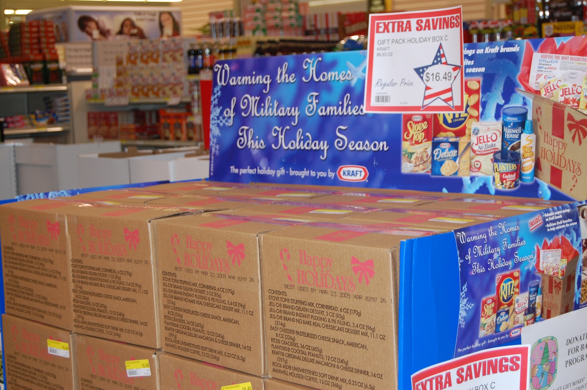Pre-packaged holiday gift boxes are available for purchase at the Commissary now. The display, shown here, is located just inside the entrance doors in the center of the holiday foods area. The store received a one-time supply of 60 boxes. (U.S. Air Force photo/Valerie Mullett)