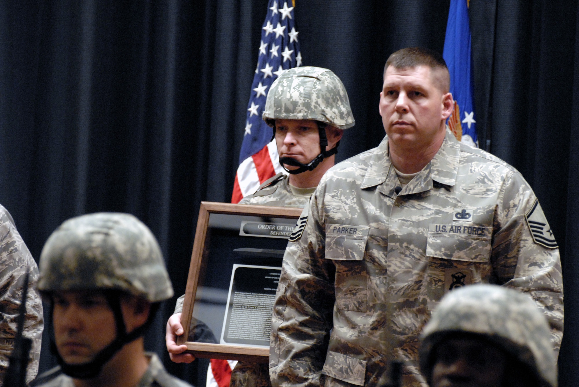 Master Sgt. Jason Parker stands at attention during the reading of the citation and the presentation of the award of the Order of the Bayonet for Sergeant Jason Parker in the U.S. Air Force Expeditionary Center's Grace Peterson Hall Nov. 28, 2008, on Fort Dix, N.J.  Sergeant Parker, now stationed at the 92nd Security Forces Squadron at Fairchild Air Force Base, Wash., was nominated for the award while serving as a member of the Expeditionary Center's 421st Combat Training Squadron. (U.S. Air Force Photo/Staff Sgt. Paul R. Evans)