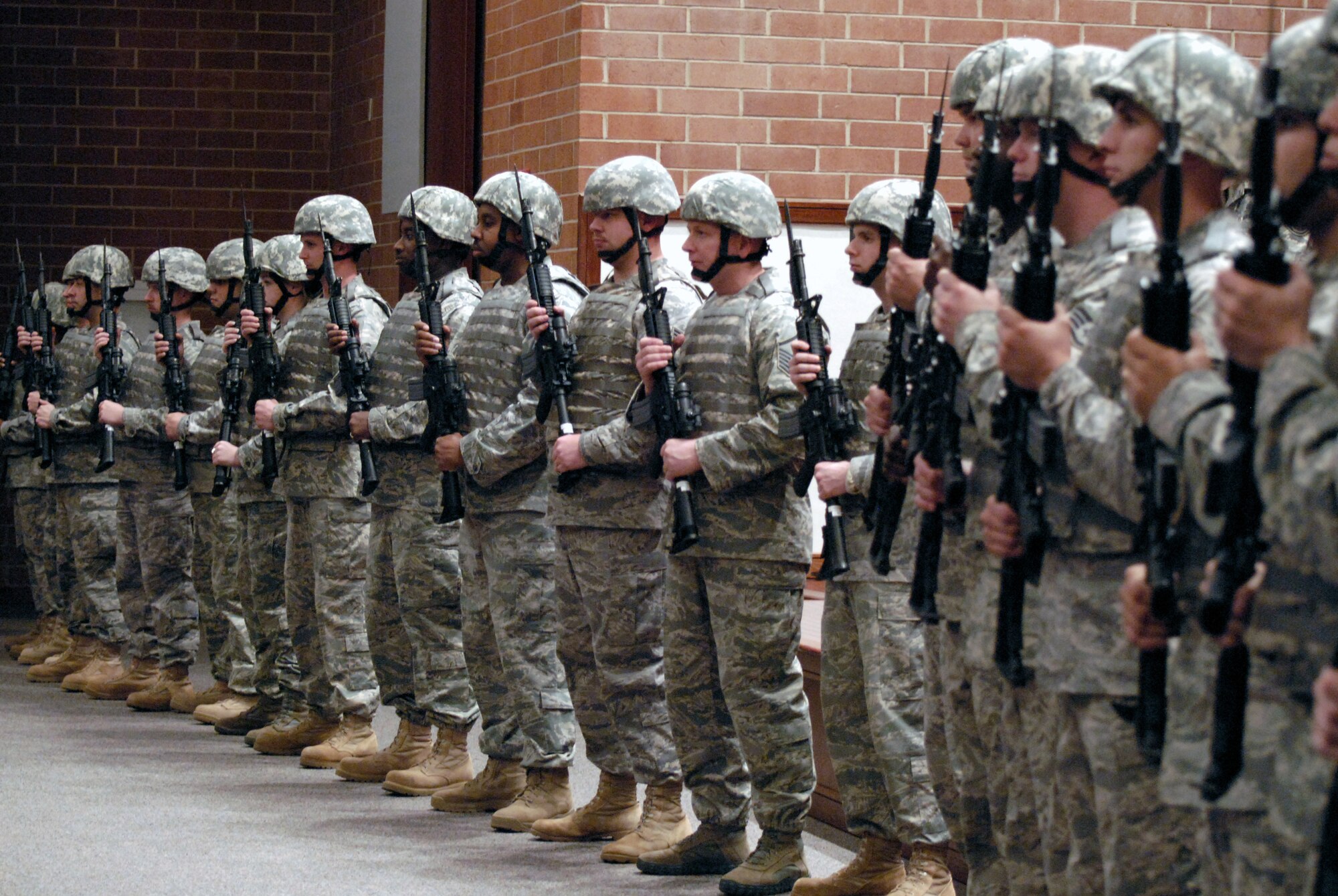 Security forces Airmen from the U.S. Air Force Expeditionary Center stand in a formation of more than 20 during the Order of the Bayonet induction ceremony Nov. 24, 2008, for Master Sgt. Jason Parker in the USAF EC's Grace Peterson Hall on Fort Dix, N.J.  Sergeant Parker, now stationed at the 92nd Security Forces Squadron at Fairchild Air Force Base, Wash., was nominated for the award while serving as a member of the Expeditionary Center's 421st Combat Training Squadron. (U.S. Air Force Photo/Staff Sgt. Paul R. Evans)