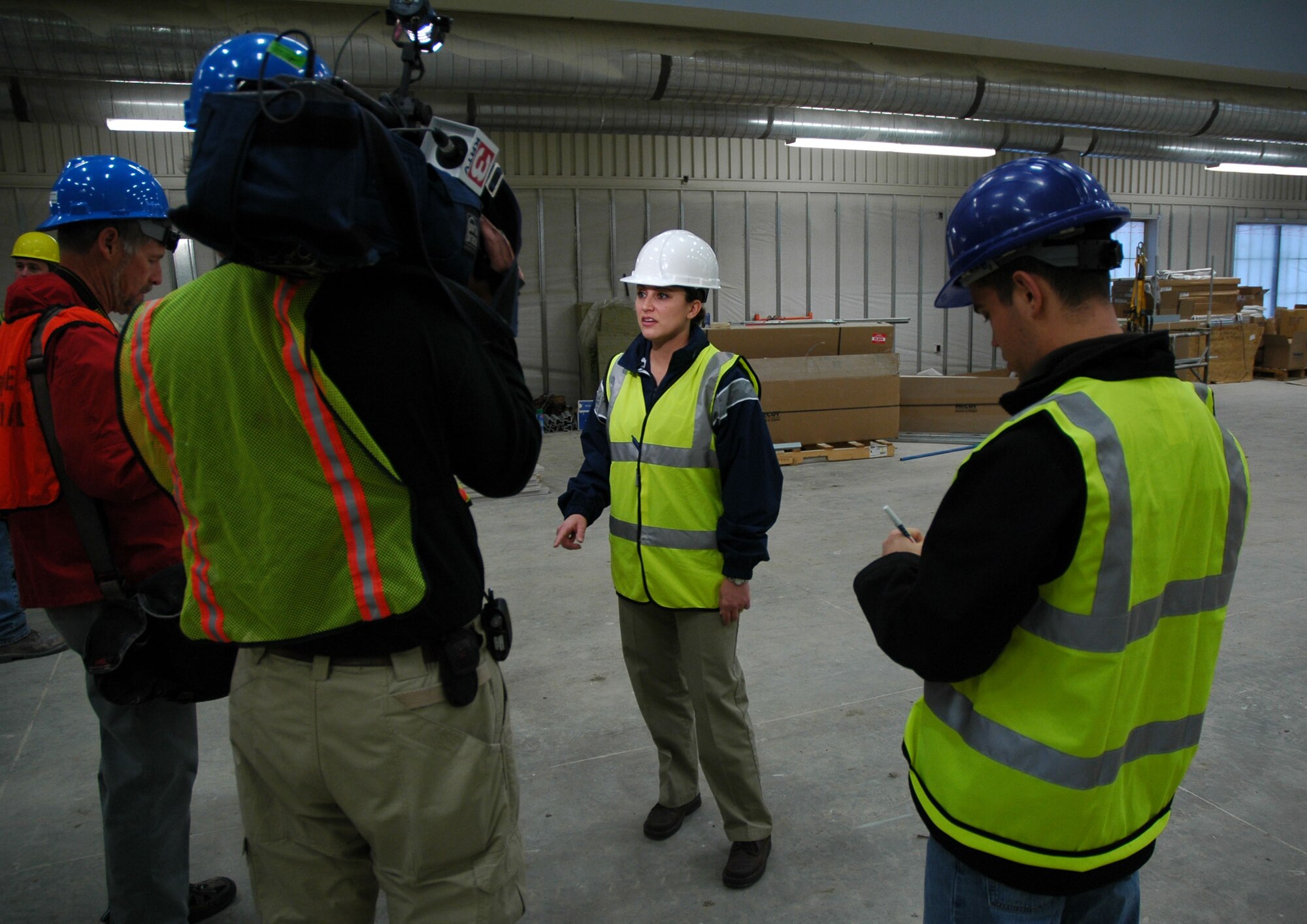 1st Lt. Jacelyn Splichal, 341st Force Support Squadron officer in charge of the base sports and fitness center, leads members of the local news media on a tour of the new fitness center here Nov. 18, 2008. (U.S. Air Force photo/Senior Airman Dillon White)