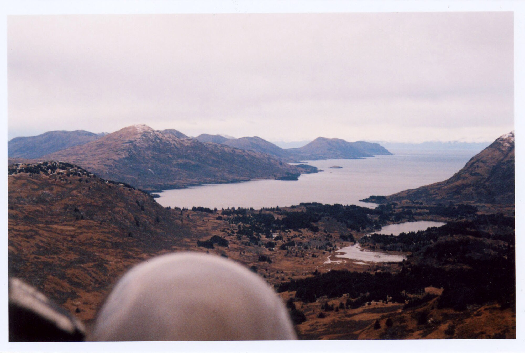 An aerial shot of Viekoda Bay, Kodiak Island, Alaska. Tech. Sgt. Matthew Sutton and his hunting partner, Bill Bush, were hunting on the ridge in the right of the photo when Sergeant Sutton was attacked by three brown bears. Their cabin was across the bay on the left side of the photo and it took the two men an hour and a half to return there by inflatable boat after the attack. (Courtesy photo)