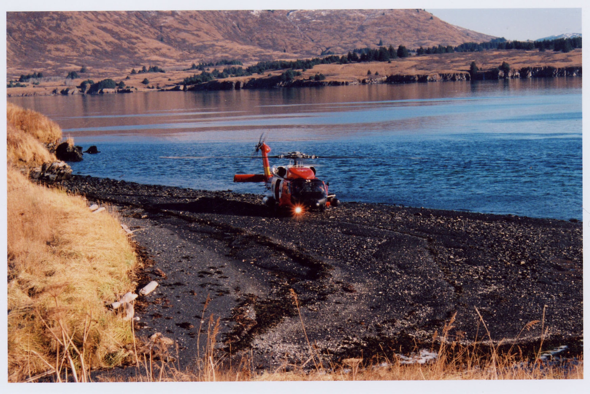 An HH-60 Jayhawk Coast Guard helicopter lands on the beach of Kodiak Island in preparation of airlifting Tech. Sgt  Matthew Sutton for medical care. The 341st Operations Group NCO in charge of supply was attacked by three brown bears while on a hunting trip there Oct. 26. (Courtesy photo)
