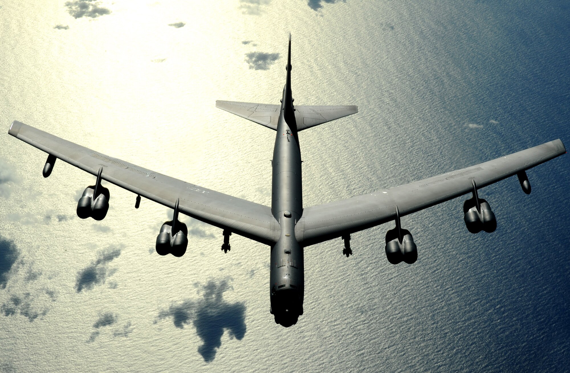 A B-52 Stratofortress from Minot Air Force Base, N.D., flies over the Pacific Ocean Nov. 12. The B-52 is deployed to Andersen AFB, Guam, as part of U.S. Pacific Command's continuous bomber presence in the region. (U.S. Air Force photo/Master Sgt. Kevin J. Gruenwald) 
