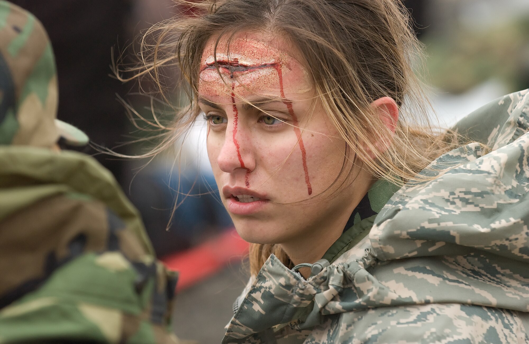 Airman Alexandria Yeddo, 436th Mission Support Squadron, wears a head gash moulage created by Terry Kauffman during aMajor Accident Response Exercise at Dover Air Force Base. Mr. Kauffman uses his hobby in moulage to make exercises at Dover Air Force Base and local hospitals feel more realistic.  (U.S. Air Force Photo/Jason Minto)
