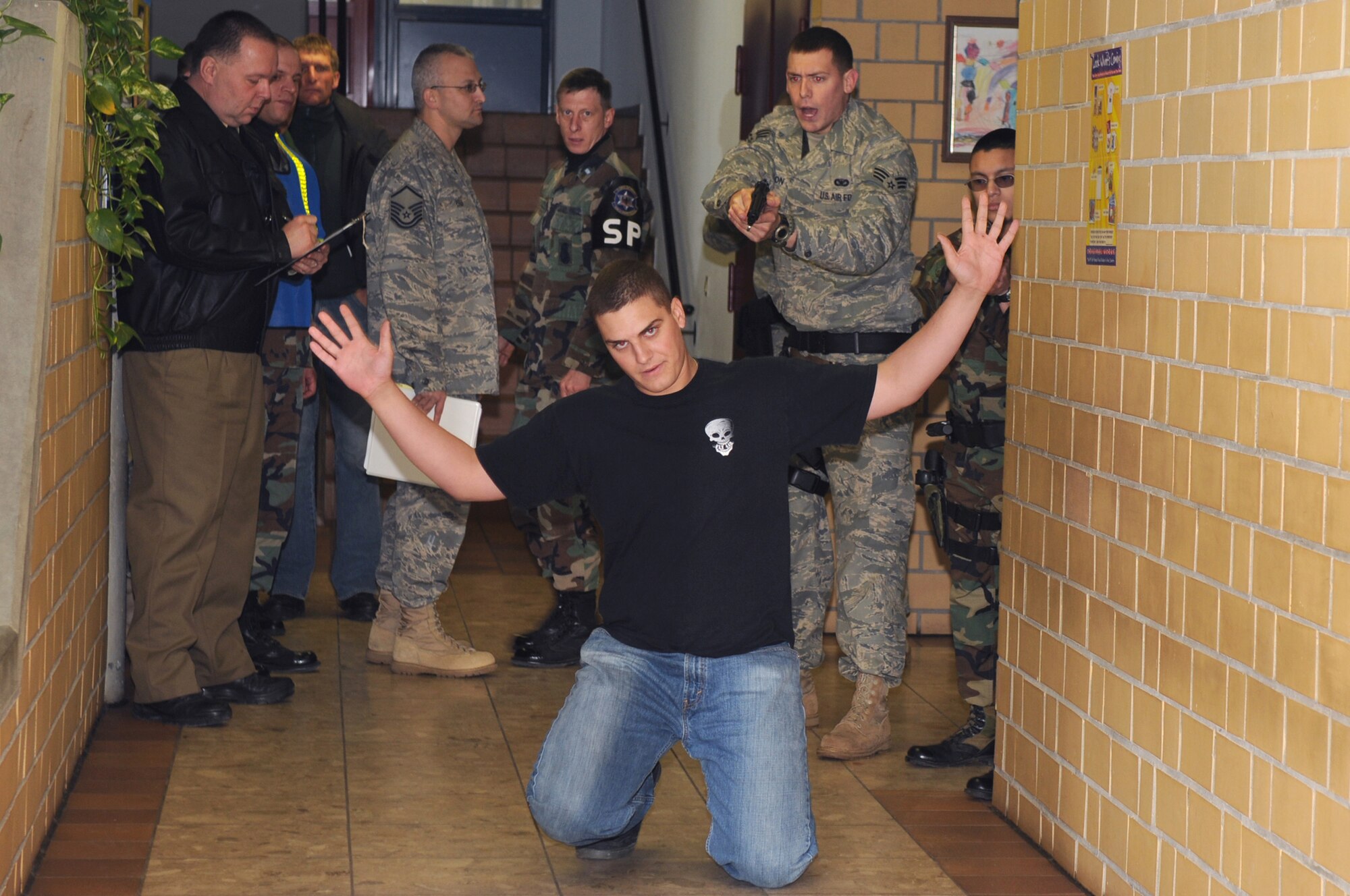 A member of the special reaction team, 569th U.S. Forces Police Squadron detain during a school shooter exercise, Vogelweh Air Base, Germany Nov. 15. The purpose of the exercise was to prepare the 569th USFPS, Polizei, and school personnel in tactics and procedures used during a school shooting. (U.S. Air Force photo by Senior Airman Kelly LeGuillon)