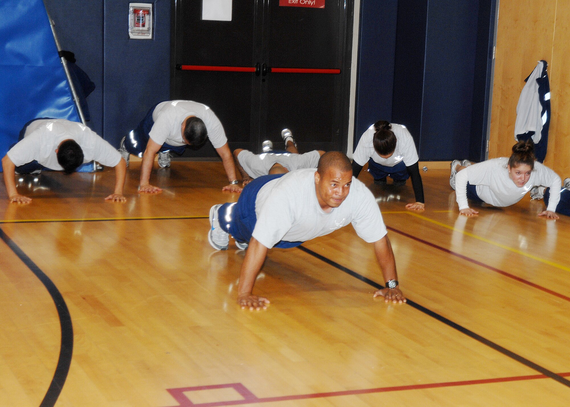 Airmen complete as many push-ups in five minutes as they can during a PT-A-Thon held at the Dragon Fitness Center here Nov. 25.  More than 150 Airmen participated in the 31st Logistics Readiness Squadron sponsored event, raising more than $3,000 for the CFC. (U.S. Air Force photo/Senior Airman Taylor Marr)