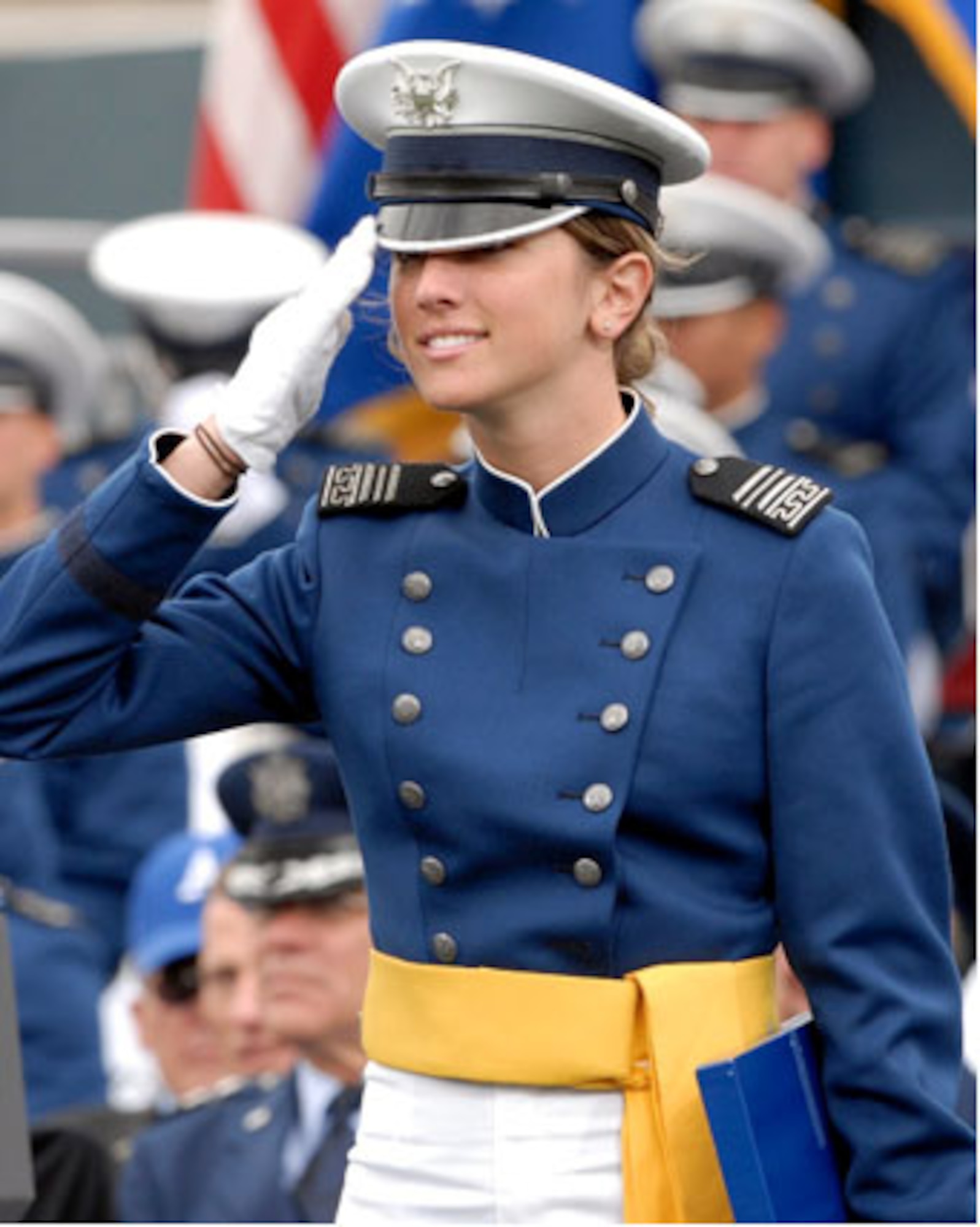 2nd Lt. Katie Newkirk, 501st Combat Support Wing, Royal Air Force Alconbury, United Kingdom, salutes during her graduation from the U.S. Air Force Academy May 2008.  Lieutenant Newkirk is a former enlisted Airman selected to attend the Air Force Academy through the Leaders Encouraging Airmen Development program.  (Courtesy Photo)