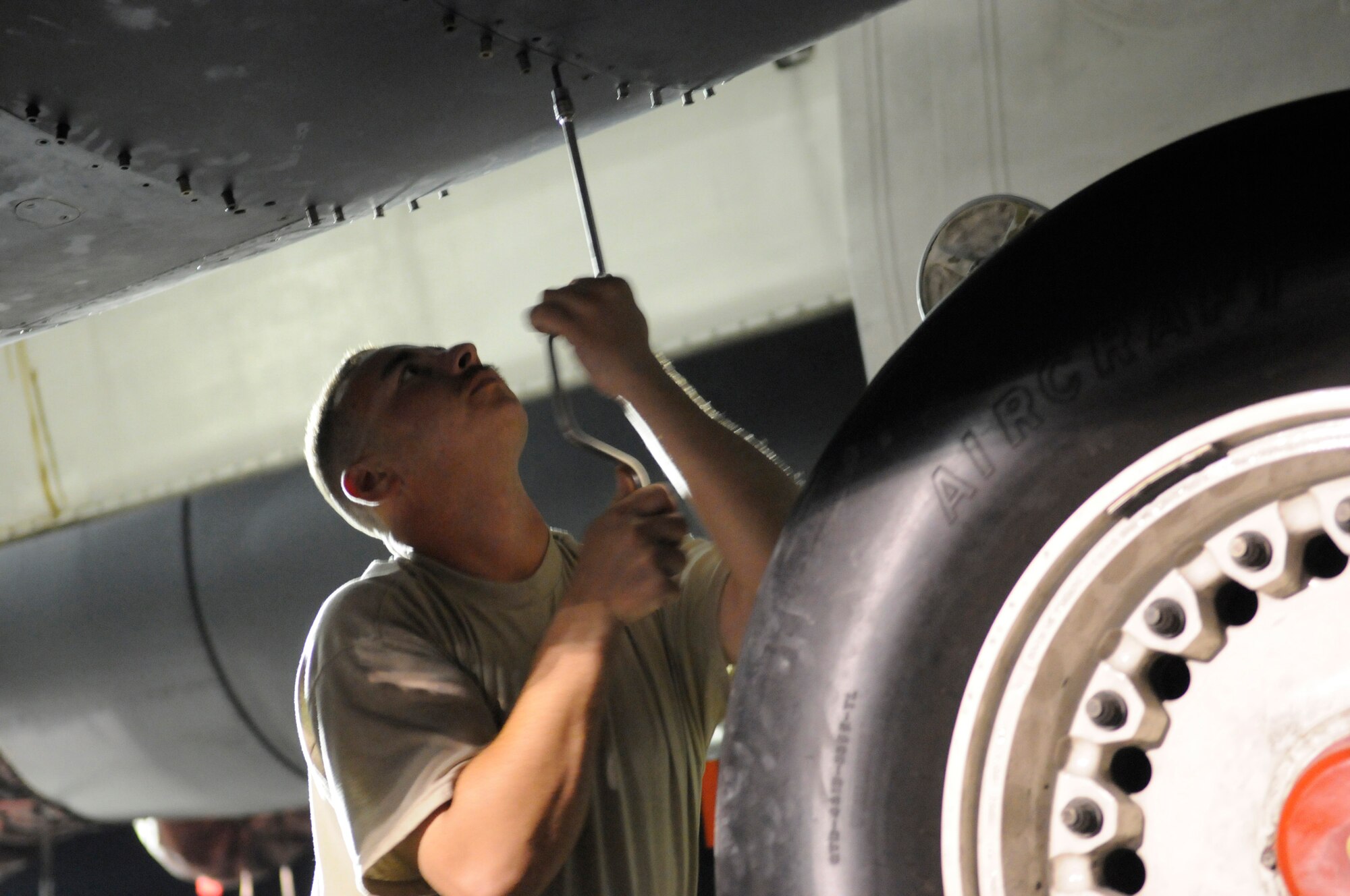 Staff Sgt. Vince Billyk, crew chief assigned to the 379th Expeditionary Aircraft Maintenance Squadron, screws in fasteners on a gearbox panel of a B-1 Lancer, Nov. 24, at an undisclosed air base in Southwest Asia.  Carrying the largest payload of both guided and unguided weapons in the Air Force inventory, the multi-mission B-1 is the backbone of America's long-range bomber force. It can rapidly deliver massive quantities of precision and non-precision weapons against any adversary, anywhere in the Central Command area of responsibility.  Sergeant Billyk is a native of Philadelphia, Pa., and is deployed from Ellsworth Air Force Base, S.D., in support of Operations Iraqi and Enduring Freedom and Joint Task Force-Horn of Africa.  (U.S. Air Force photo by Tech. Sgt. Michael Boquette/Released)