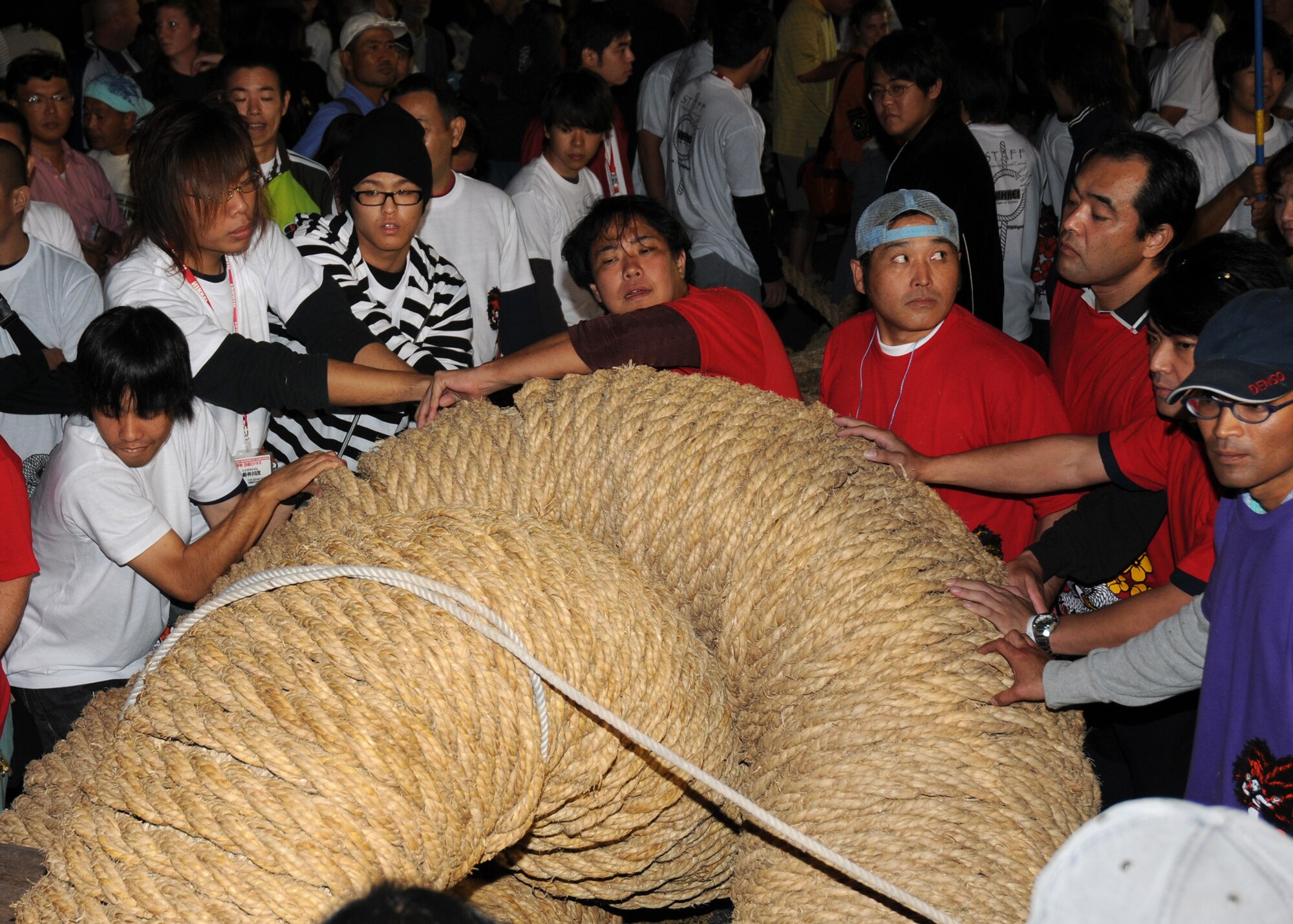 Japanese locals pull together two ropes from the east and the west side for a giant rope for tug-of-war at the Okinawa International Carnival Nov. 22, 2008 near Kadena Air Base. The Okinawa International Carnival is held every year with events from car shows and dancing, to a giant rope for tug-of-war. (U.S. Air Force photo/Airman 1st Class Amanda Grabiec)