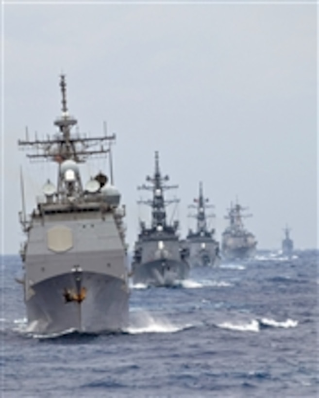 The guided-missile cruiser USS Shiloh (CG 67) leads a formation of U.S. Navy and Japanese Maritime Self-Defense Force ships assigned to the George Washington Carrier Strike Group and the Essex Expeditionary Strike Group through the East China Sea during an exercise on Nov. 19, 2008.  The exercise is conducted yearly by U.S. and Japanese naval forces to continually improve their working relationship.  